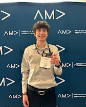 Owen Lencki in front of an AMA backdrop
