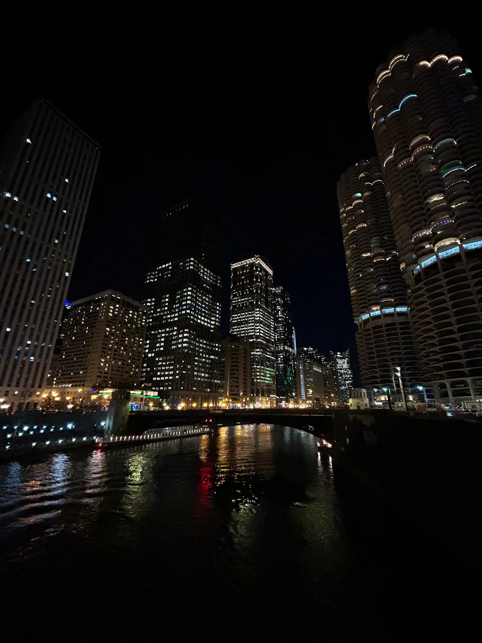 Downtown Chicago lights viewed across the river at night.